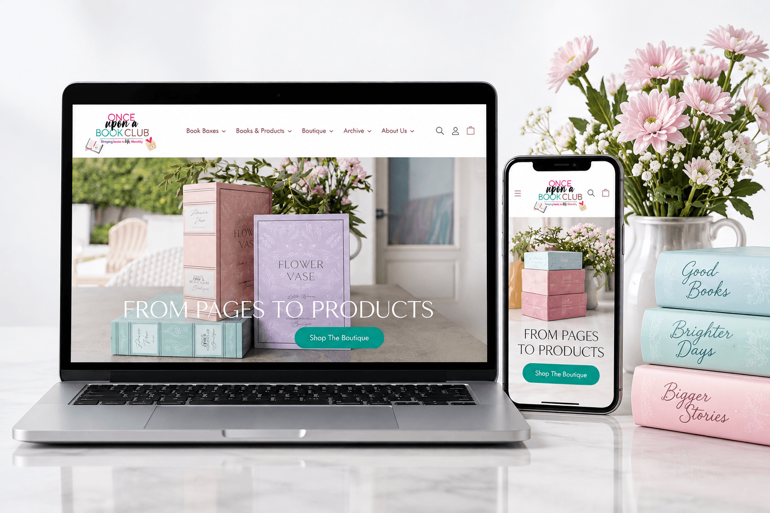 Once Upon a Book Club Shopify storefront in laptop and phone mockups alongside the book boxes